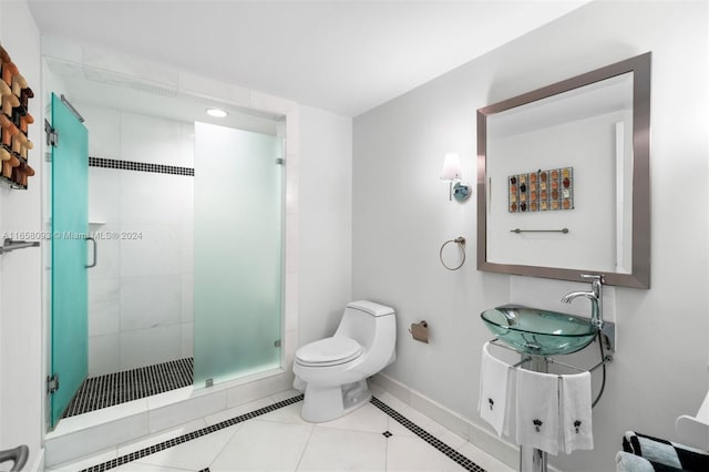 bathroom featuring walk in shower, vanity, tile patterned flooring, and toilet