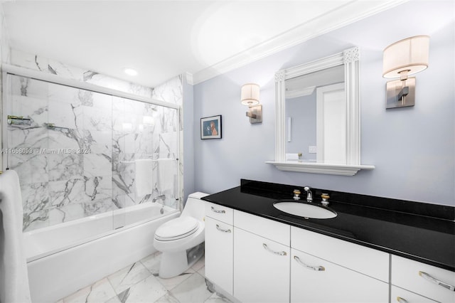 full bathroom featuring ornamental molding, vanity, enclosed tub / shower combo, and toilet