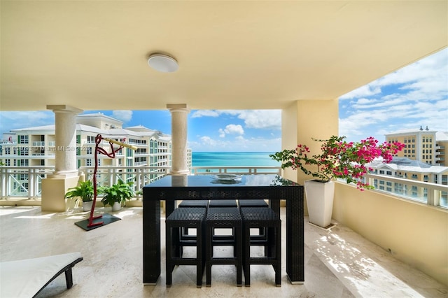 balcony featuring a water view