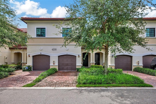 mediterranean / spanish house featuring a garage