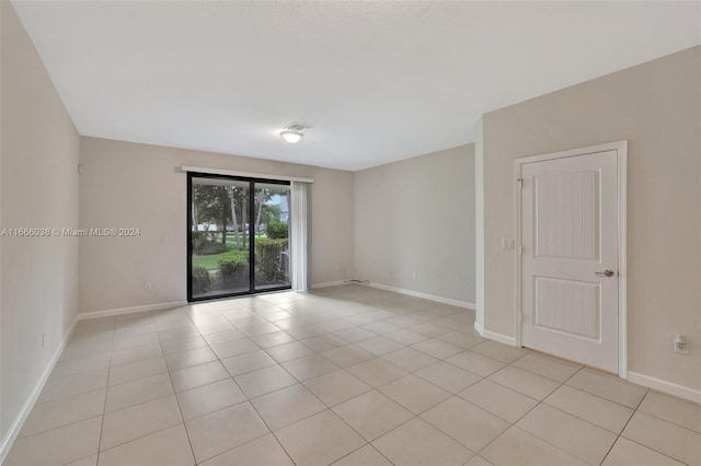 unfurnished room featuring light tile patterned floors