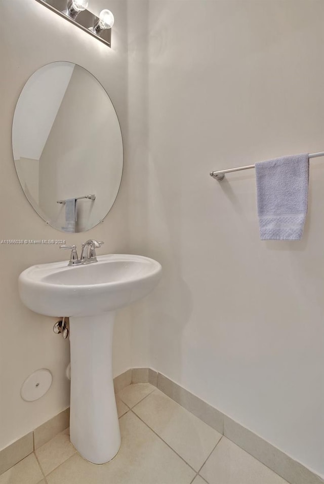 bathroom featuring sink and tile patterned flooring