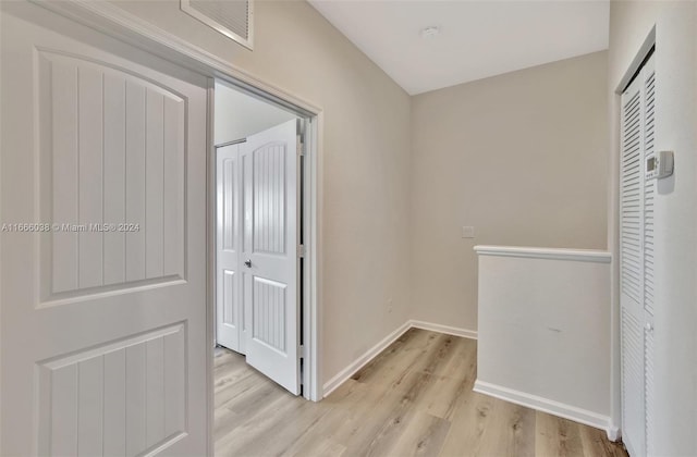 corridor featuring light hardwood / wood-style floors