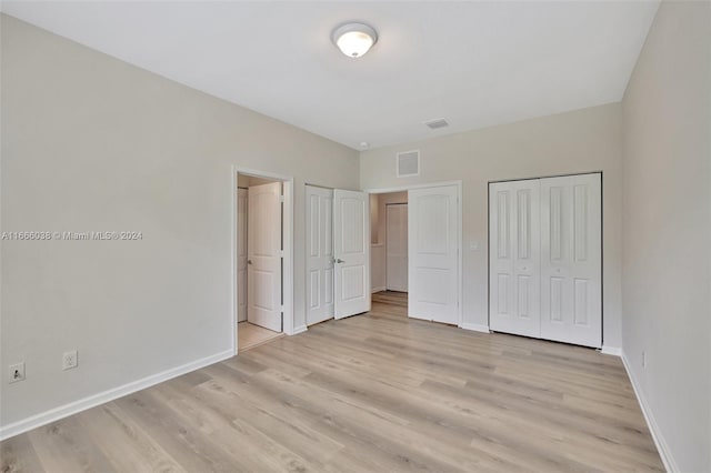 unfurnished bedroom with light hardwood / wood-style flooring