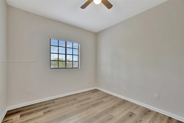 unfurnished room with light hardwood / wood-style flooring and ceiling fan