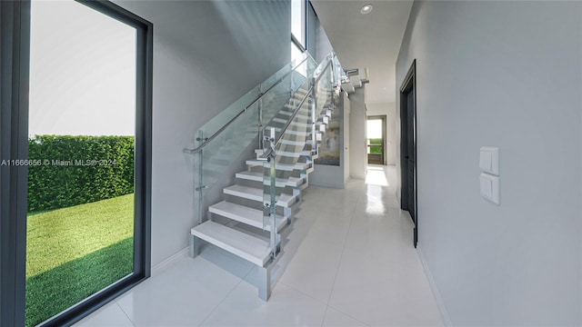 stairs featuring tile patterned floors