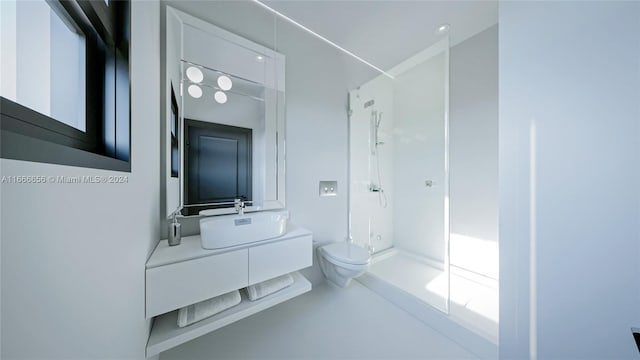 bathroom with a shower, vanity, toilet, and concrete floors