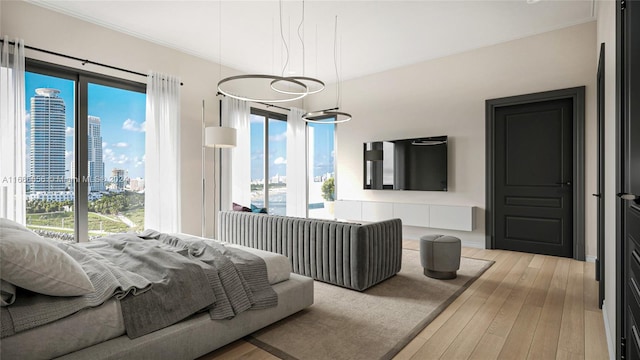 bedroom featuring light wood-type flooring and crown molding