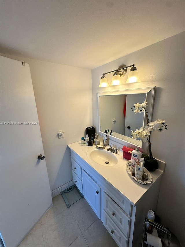 bathroom with tile patterned flooring and vanity