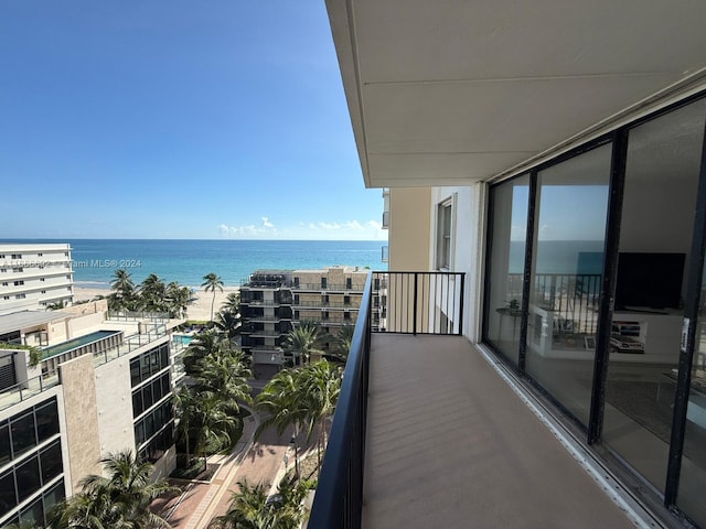 balcony featuring a water view