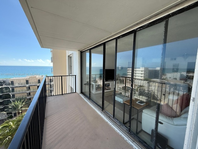 balcony featuring a water view