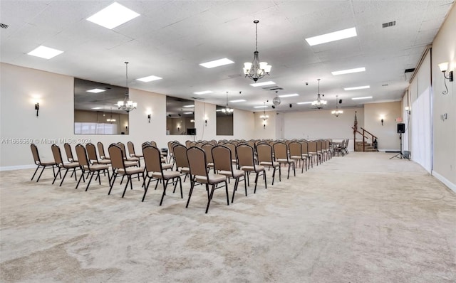 interior space with light carpet and a notable chandelier