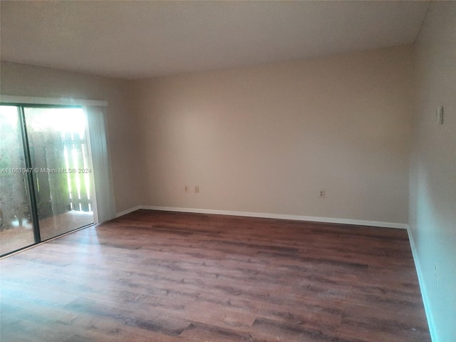 unfurnished room with hardwood / wood-style floors