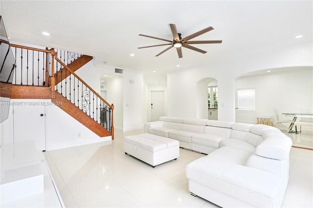 living room featuring ceiling fan and light tile patterned floors