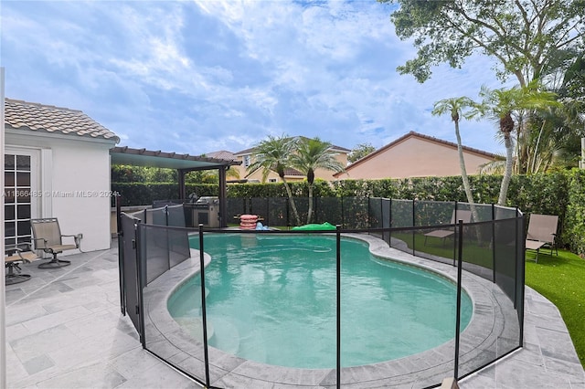 view of pool featuring a patio and a pergola