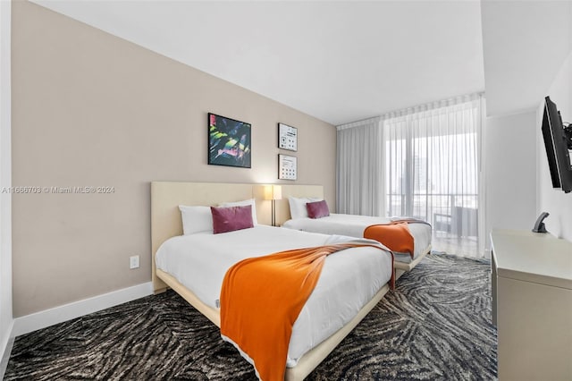 bedroom with dark colored carpet