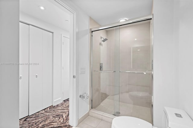 full bath featuring a stall shower, toilet, recessed lighting, and tile patterned floors