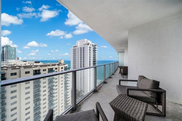 balcony featuring a water view