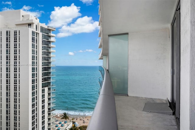 balcony with a view of the beach and a water view