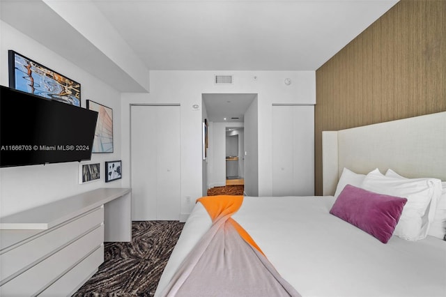 carpeted bedroom with visible vents
