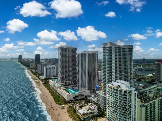 city view featuring a view of the beach and a water view