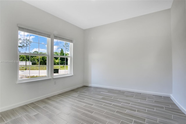 unfurnished room with light wood-type flooring