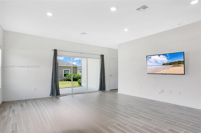 empty room with light hardwood / wood-style floors