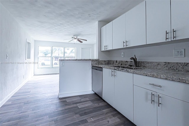 kitchen featuring white cabinets, stainless steel dishwasher, ceiling fan, dark hardwood / wood-style flooring, and kitchen peninsula