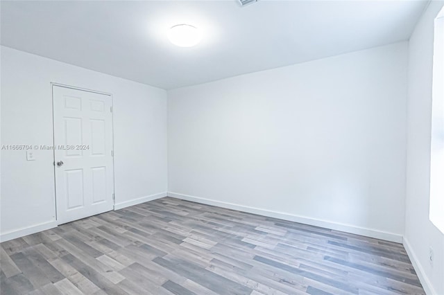 spare room featuring light wood-type flooring