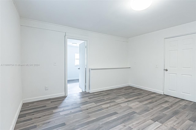 spare room with hardwood / wood-style flooring