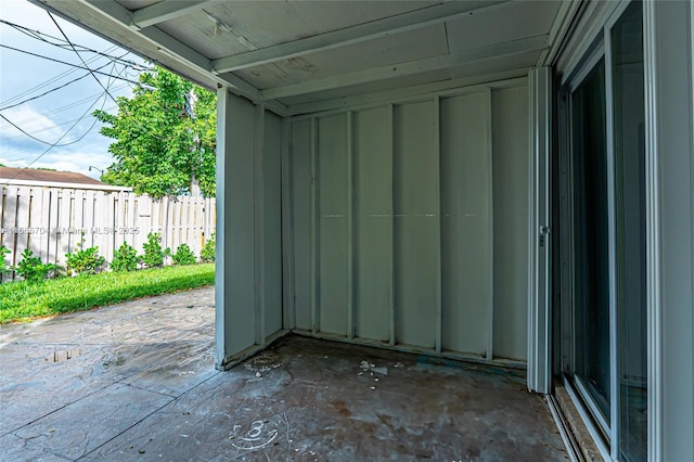 view of patio featuring fence