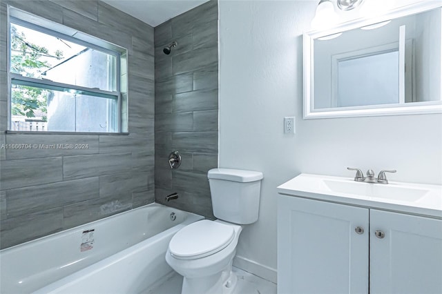 full bathroom with vanity, toilet, and tiled shower / bath