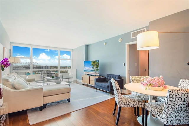 living room featuring hardwood / wood-style floors and expansive windows