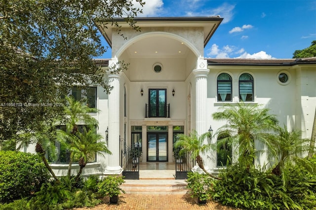 view of exterior entry featuring french doors