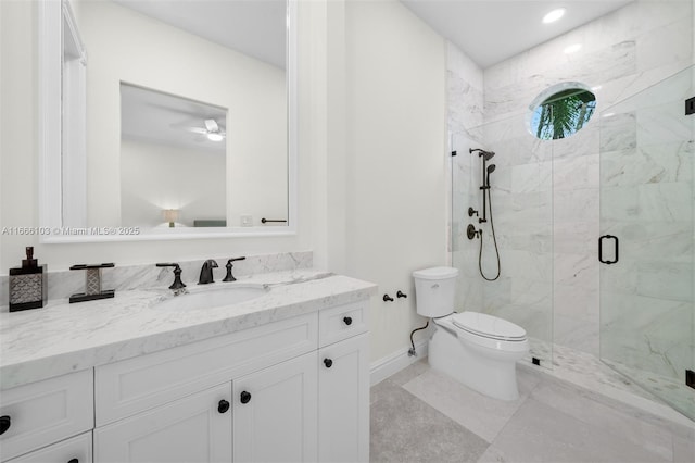 bathroom featuring vanity, toilet, an enclosed shower, and ceiling fan