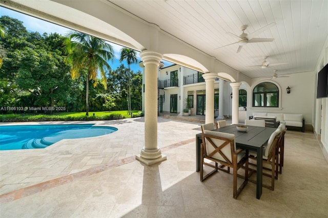 view of pool featuring ceiling fan and a patio