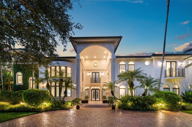 view of front of home with a balcony