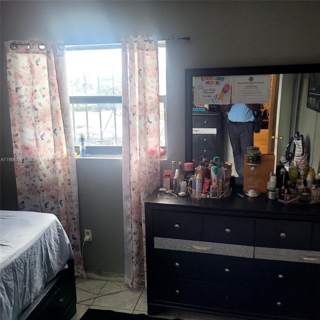 bedroom featuring light tile patterned floors