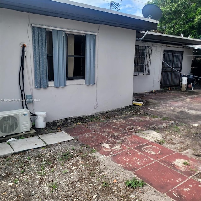 view of home's exterior featuring a patio and ac unit