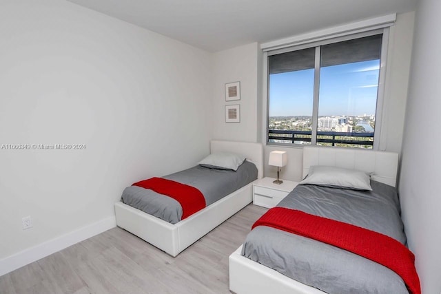 bedroom with light hardwood / wood-style flooring