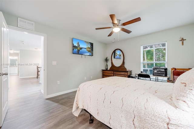 bedroom featuring hardwood / wood-style flooring and ceiling fan