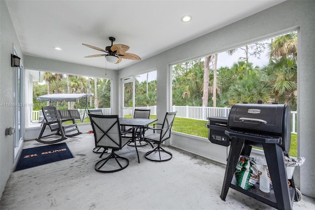 sunroom / solarium with ceiling fan