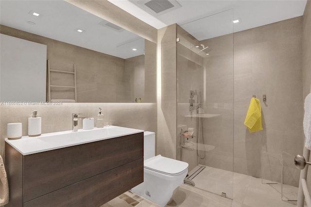 full bathroom with toilet, walk in shower, visible vents, and tile walls