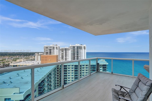 balcony with a view of city and a water view