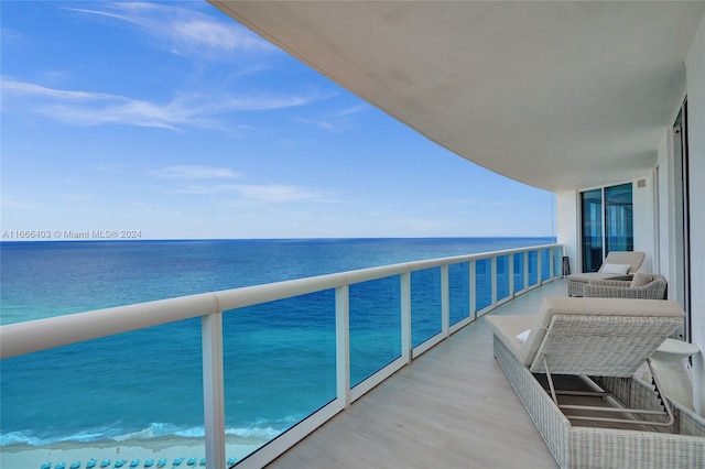 balcony featuring a water view