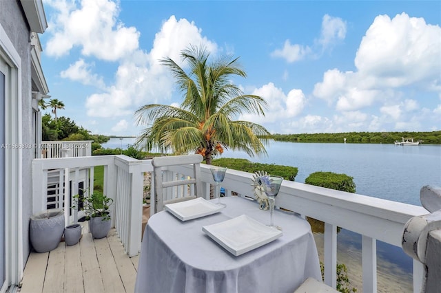 balcony featuring a water view