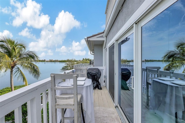 balcony featuring a water view