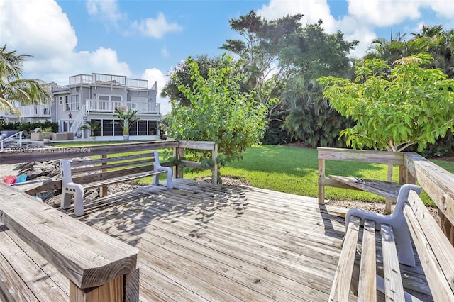 wooden terrace with a yard