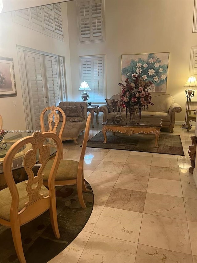 dining room featuring a high ceiling