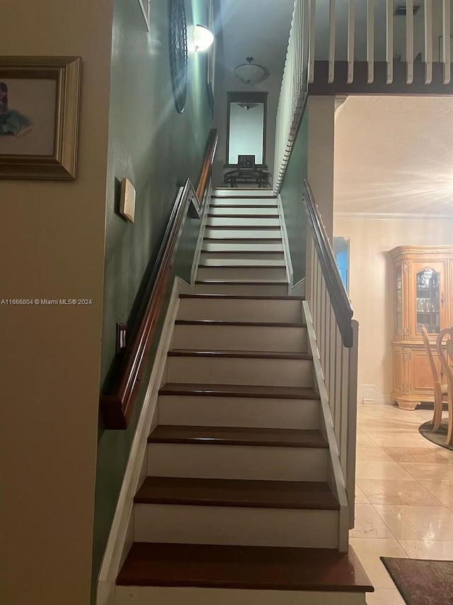 stairs with tile patterned floors